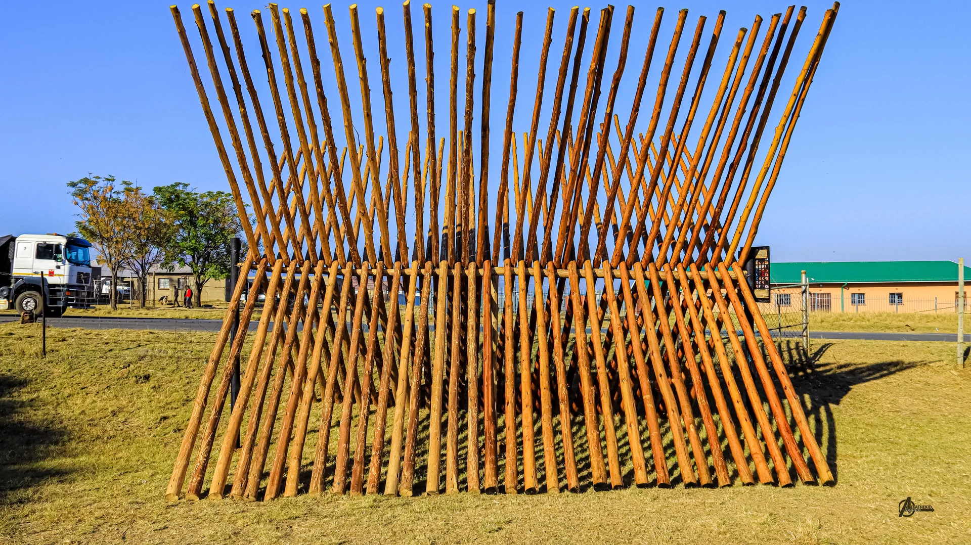 Treated wooden fence posts installed along a rural farm boundary